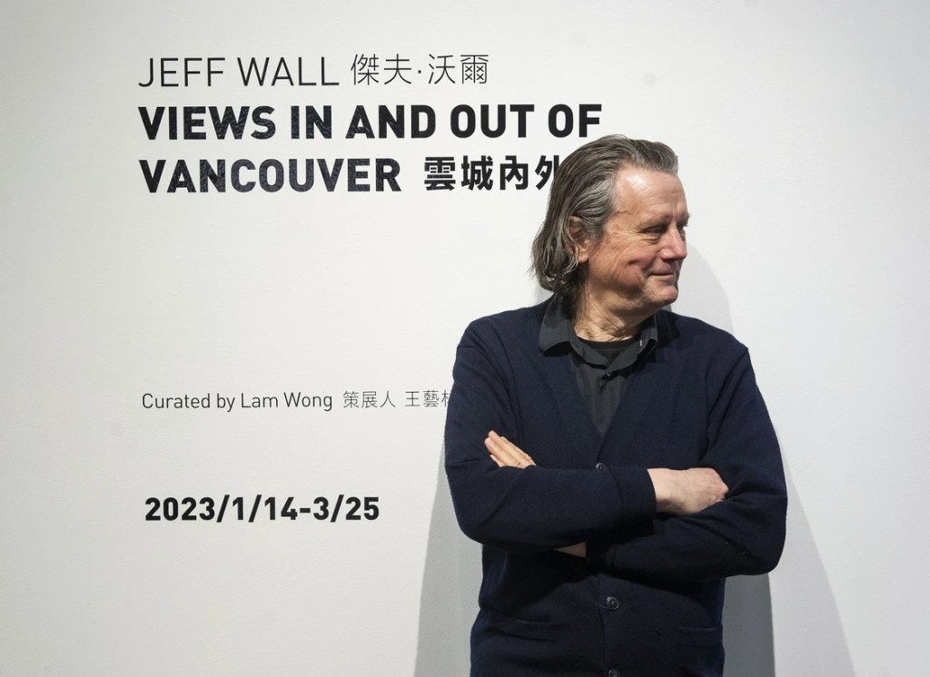 Jeff Wall at Canton-sardine, in front of his solo exhibition title wall "Views in and out of Vancouver"